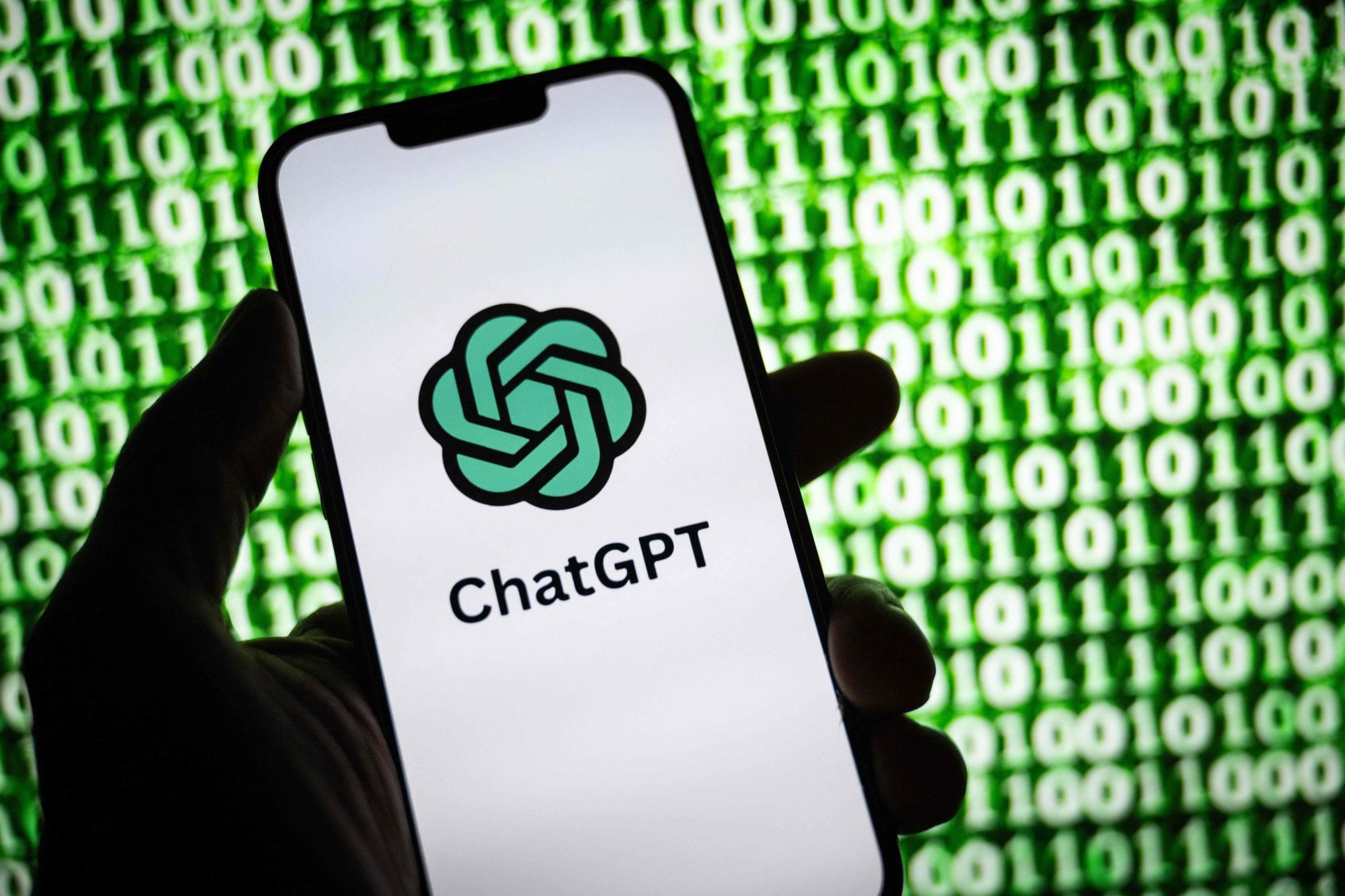 (FILES) This illustration photograph taken on October 30, 2023, shows the logo of ChatGPT, a language model-based chatbot developed by OpenAI, on a smartphone in Mulhouse, eastern France. Hundreds of staff at ChatGPT's parent company OpenAI have signed a letter threatening to leave the tech firm unless "all current board members resign," according to US media reports on November 20, 2023. (Photo by SEBASTIEN BOZON / AFP)