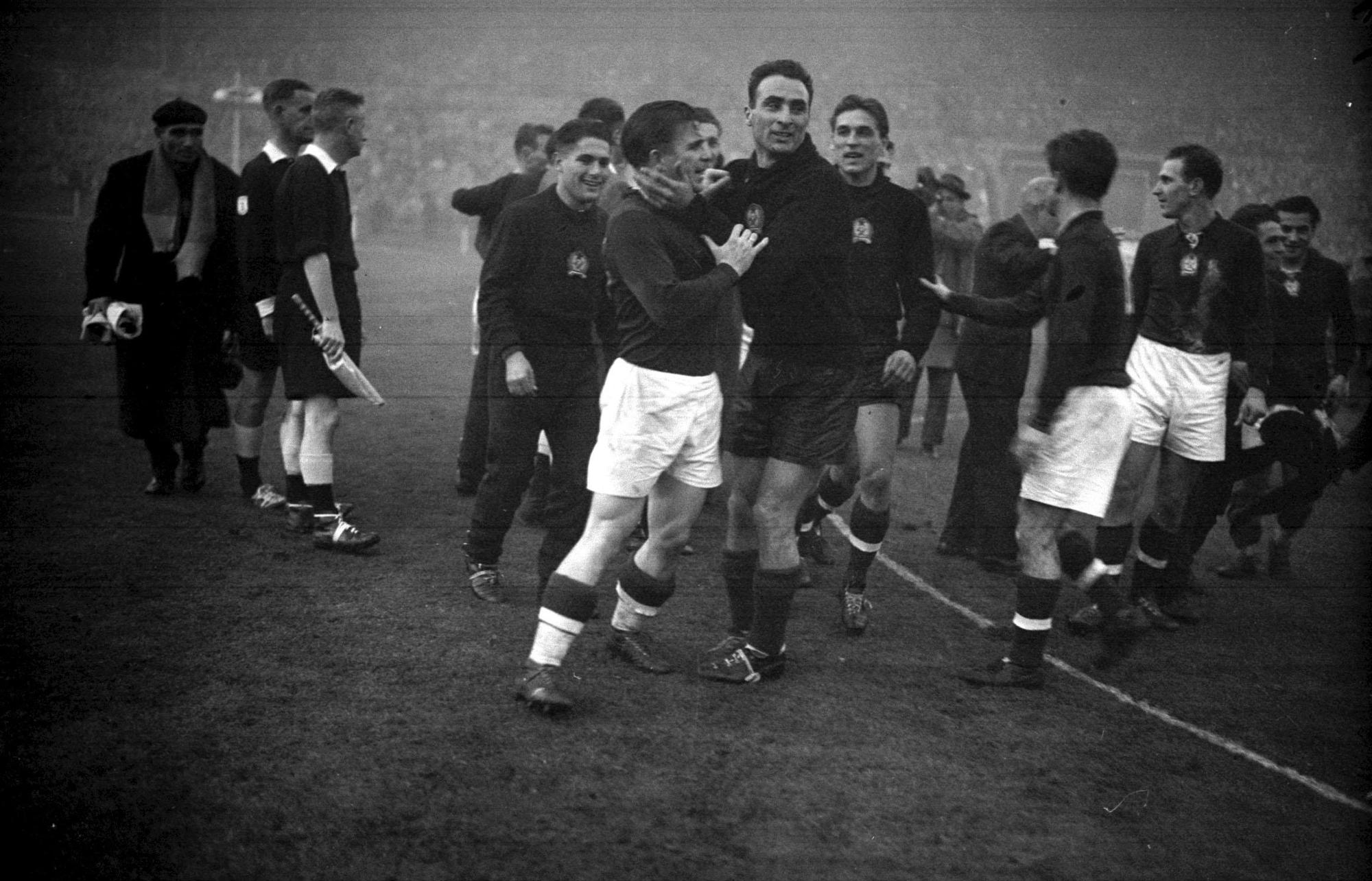 Hungarian goalkeeper Sandor Geller (right) embraces his captain, inside-left Ferenc Puskas after Hungary had defeated England 6-3 in the International match at the Empire Stadium Wembley in London, England's first ever defeat at home (Photo by PA Images via Getty Images)