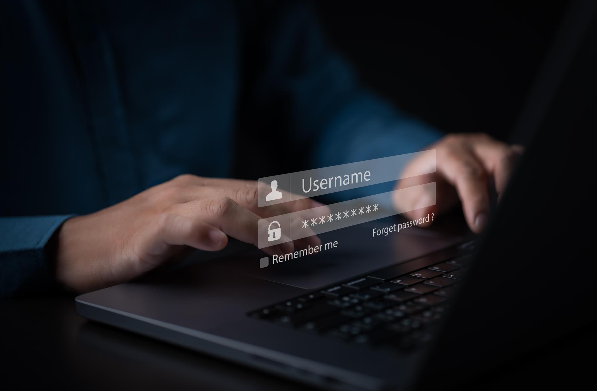 Businessman use laptop to login account by entering username and password. Cyber security identity for account and cloud network system application. Internet personal data privacy, Online protection.