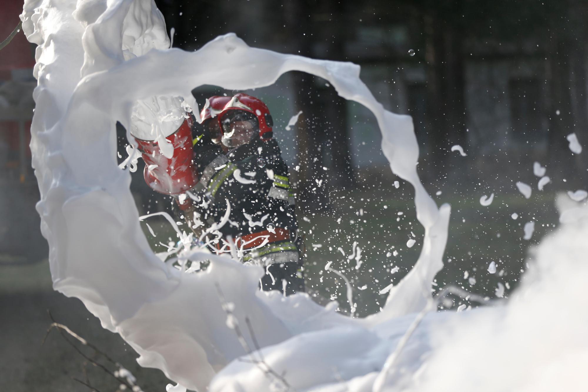 KWTDAC Belarus, Gomel, 04/06/2017, extinguishing forest fire.Extinguishing the fire. Firemen are working. Fill the foam with a fire. Resolute firefighters. F