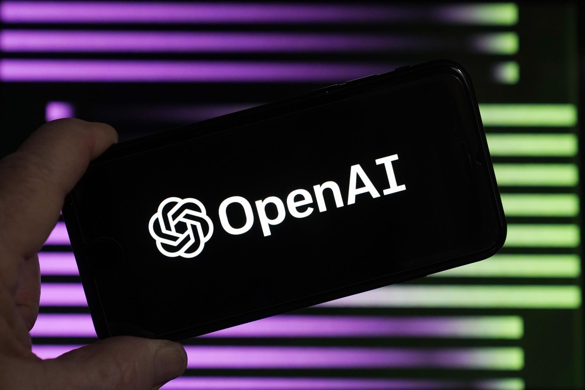 FILE - The logo for OpenAI, the maker of ChatGPT, appears on a mobile phone, in New York, Jan. 31, 2023. Lawmakers in Brazil?s southern city of Porto Alegre Brazil have enacted legislation written entirely by artificial intelligence. The experimental ordinance was passed in October and city councilman Ramiro Rosário revealed on Thursday, Nov. 29, 2023, that it was written by a chatbot, sparking objections and raising questions about the role of artificial intelligence in public policy. (AP Photo/Richard Drew, File)