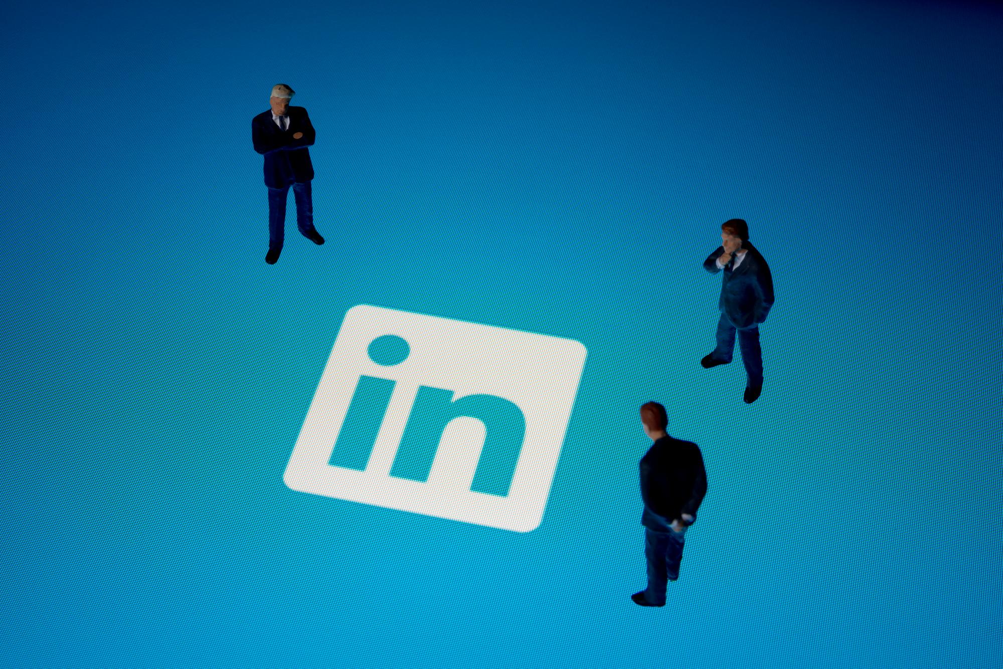 Seoul, korea - August 9, 2014 : Businessman figurines & Linkedin logo on Apple iPad. Linkedin is a business-related social networking website.