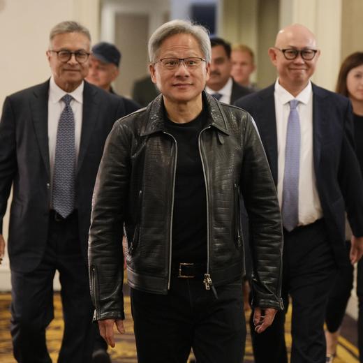 Nvidia CEO and co-founder Jensen Huang, center, arrives for a media round table event at a hotel in Kuala Lumpur, Malaysia Friday, Dec. 8, 2023. (AP Photo/Vincent Thian)  Jensen Huang