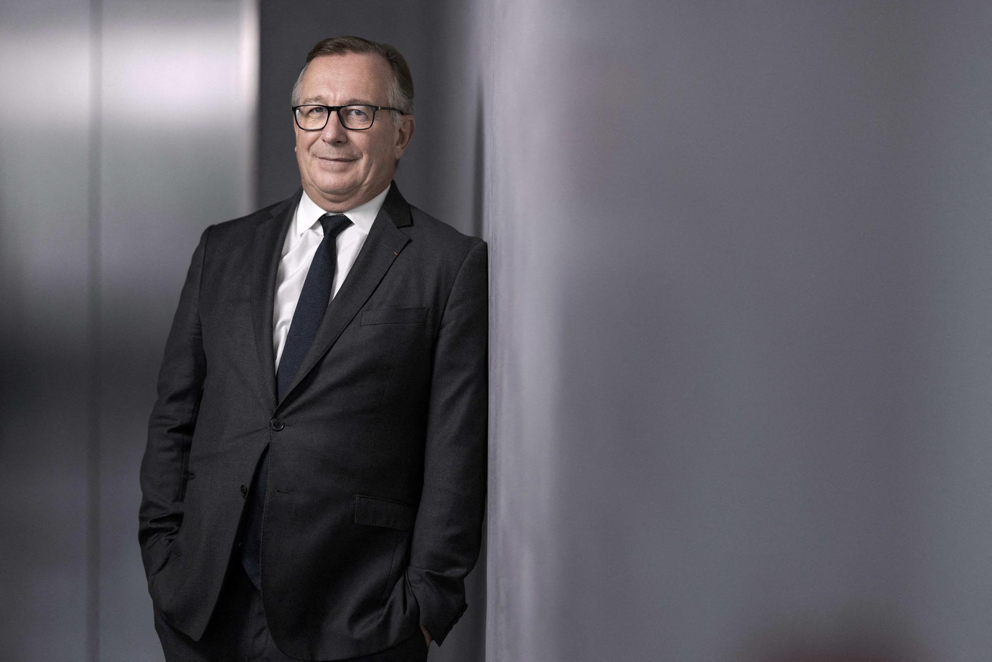 Chanel SAS' president Bruno Pavlovsky, poses during a photo session at the opening of the exhibition "On the wire: from Dakar to Paris" at the 19 M gallery in Paris on May 15, 2023. (Photo by JOEL SAGET / AFP)