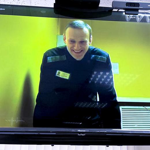 FILE - In this handout photo released by Moscow City Court Press Service, Russian opposition leader Alexei Navalny is seen on a TV screen, as he appears in a video link provided by the Russian Federal Penitentiary Service in a courtroom at Moscow City Court in Moscow, Russia, on May 31, 2023. The Kremlin on Tuesday Dec. 12, 2023 bristled at the U.S. voicing concern about Navalny who has vanished from his prison colony, denouncing it as ?inadmissible interference? in the country's domestic affairs. Worries about Navalny, who has been serving a 19-year term on charges of extremism in a penal colony in western Russia spread Monday after prison officials said he was no longer on the inmate roster, possibly indicating his transfer to another penitentiary. (Moscow City Court Press Service via AP, File)