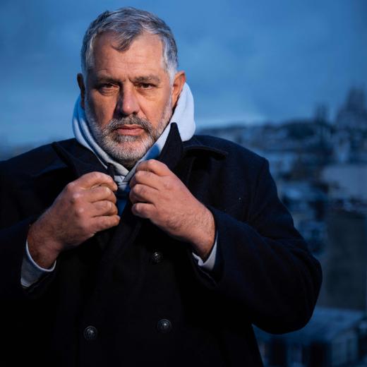 French film director Luc Jacquet poses during a photo session in Paris, on December 13, 2023. (Photo by JULIEN DE ROSA / AFP)