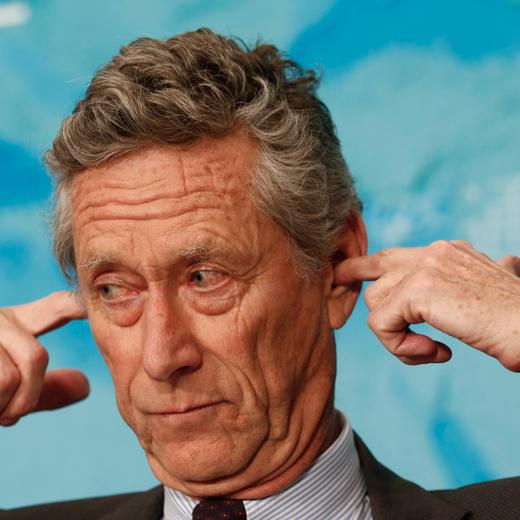 epa04570236 Olivier Blanchard, Economic Counselor and Director of Research of the International Monetary Fund (IMF), gestures for an earpiece during a press conference on the IMF World Economic Outlook update in Beijing, China, 20 January 2015. The IMF trimmed its global economic growth forecast for 2015 by 0.3 percentage points to 3.5 percent. The revision of the Washington-based crisis lender's previous forecast in October was due to slower growth in China, Russia, the eurozone and Japan, and reduced activities of oil-exporting countries. EPA/ROLEX DELA PENA