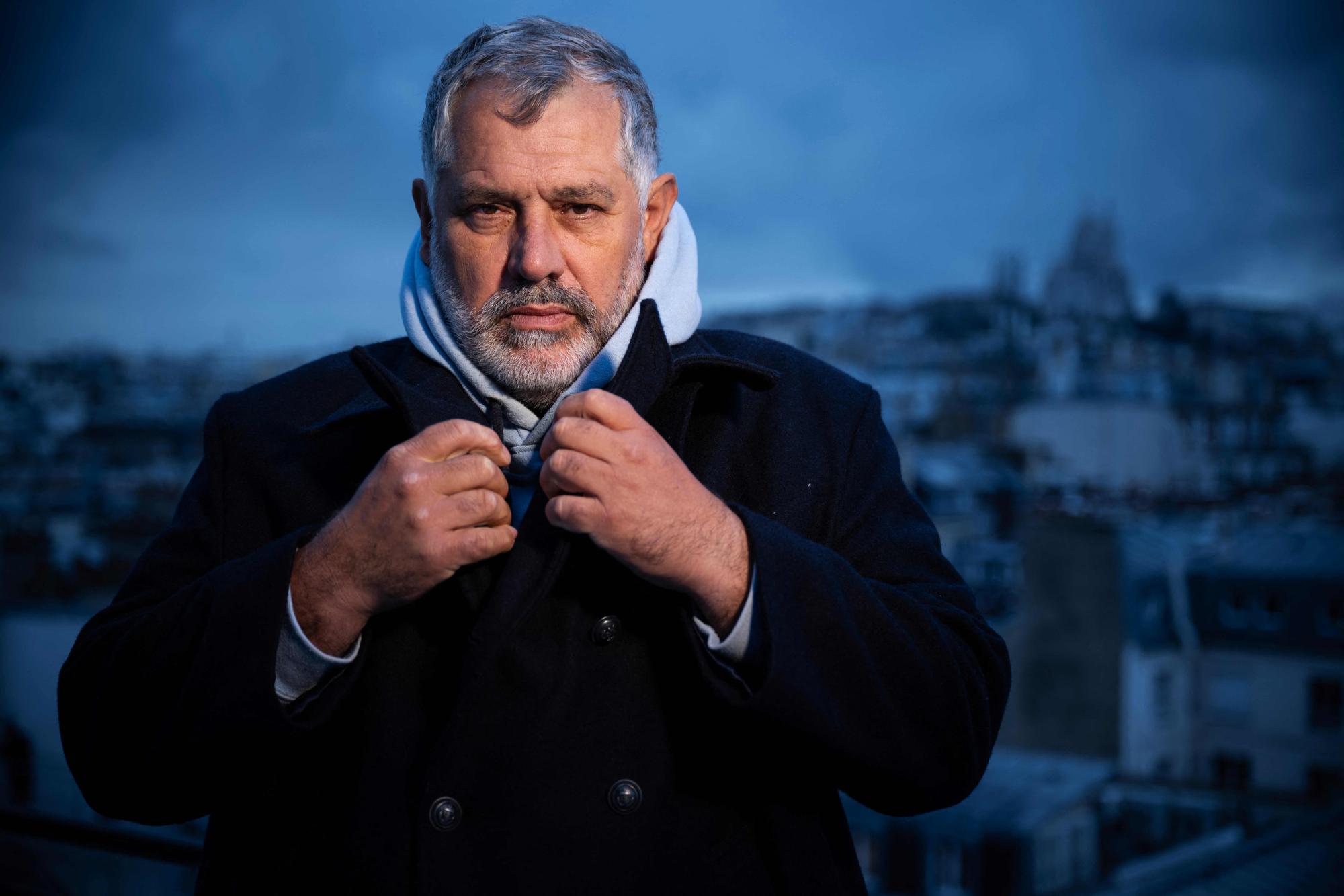 French film director Luc Jacquet poses during a photo session in Paris, on December 13, 2023. (Photo by JULIEN DE ROSA / AFP)