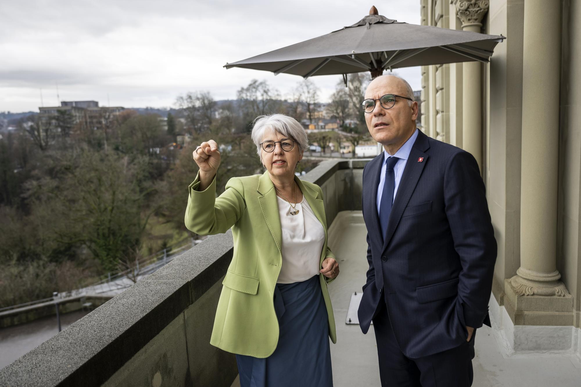 epa11028540 Swiss Federal Chancellor responsible for Justice and Police, Elisabeth Baume-Schneider (L), explains the panorama on the balcony of the Federal Council to Nabil Ammar, Minister of Foreign Affairs of Tunisia, during his visit in Bern, Switzerland, 14 December 2023. EPA/ALESSANDRO DELLA VALLE
