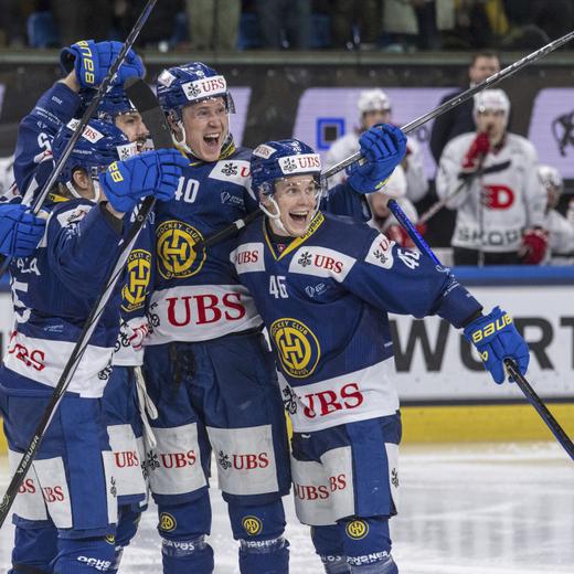 The players from Davos with Dennis Rasmussen, centre, and Dominik Egli, right, reacting after the 3:2 goal during the game between HC Davos from Switzerland and HC Dynamo Pardubice from Czech Republic at the Final of the 95th Spengler Cup ice hockey tournament in Davos, Switzerland, Sunday, Dec. 31, 2023. (Urs Flueeler/Keystone via AP)