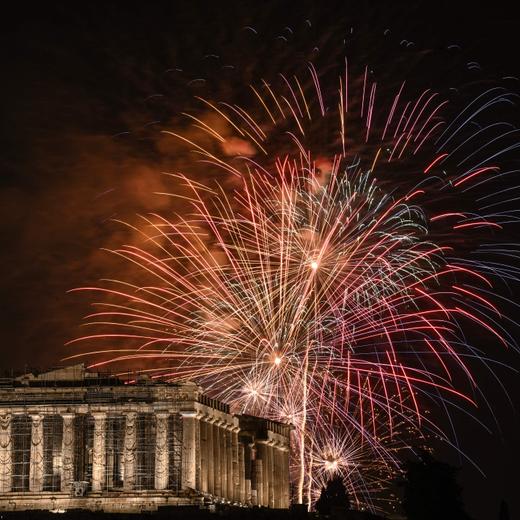 Fireworks explode over the Acropolis during New Year celebrations in Athens, early on January 1, 2024. (Photo by Angelos TZORTZINIS / AFP)