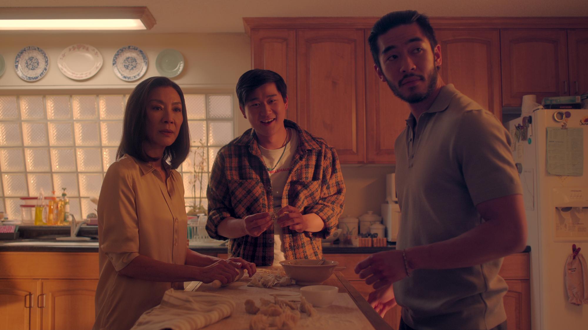 The Brothers Sun. (L to R) Michelle Yeoh as Mama Sun, Sam Song Li as Bruce Sun, Justin Chien as Charles Sun in episode 108 of The Brothers Sun. Cr. Courtesy of Netflix © 2023