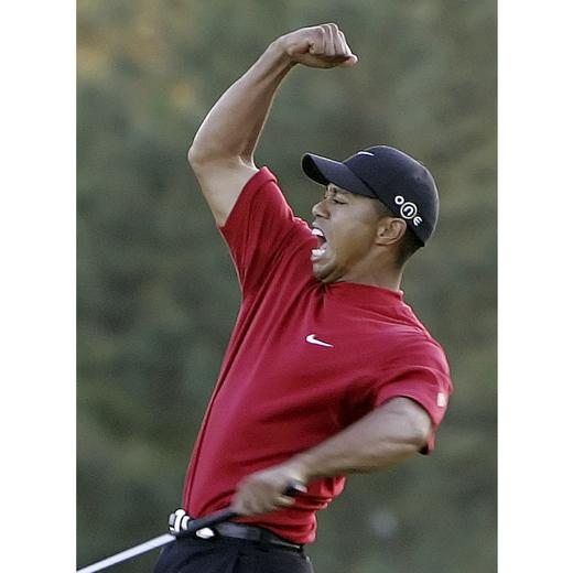 FILE _ Tiger Woods reacts to winning the 2005 Masters in a playoff with Chris DiMarco on the 18th hole during final round play of the tournament at the Augusta National Golf Club in Augusta, Ga., Sunday, April 10, 2005. Woods has ended his 27-year relationship with Nike. The swoosh was a big part of his apparel. (AP Photo/Amy Sancetta, File)
