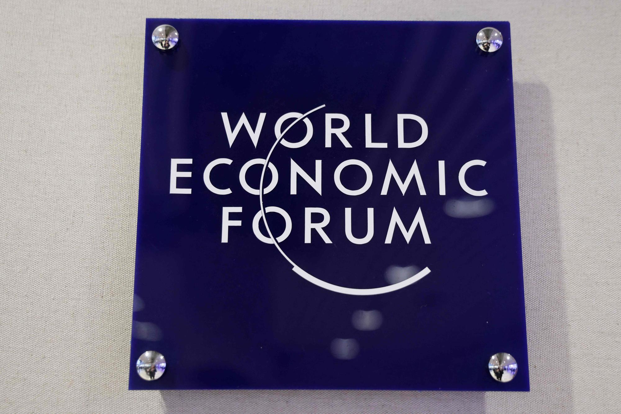Signage for the World Economic Forum (WEF) adorns a wall at the summit venue in Davos on January 17, 2024. (Photo by Ludovic MARIN / POOL / AFP)