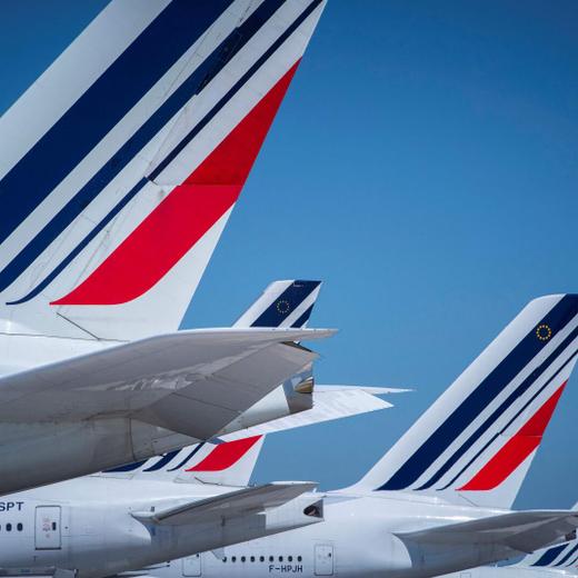 (FILES) A photograph taken on August 6, 2018 shows Air France airplanes parked on the tarmac of Roissy-Charles de Gaulle Airport, north of Paris. Paris' airports face a double challenge during the Olympics next year -- already under huge pressure, they will also give many foreign visitors' their first impression of the Games. France's main international airport, Charles-de-Gaulle (CDG), and the smaller Orly will be two crucial gateways to the Olympics. (Photo by JOEL SAGET / AFP)