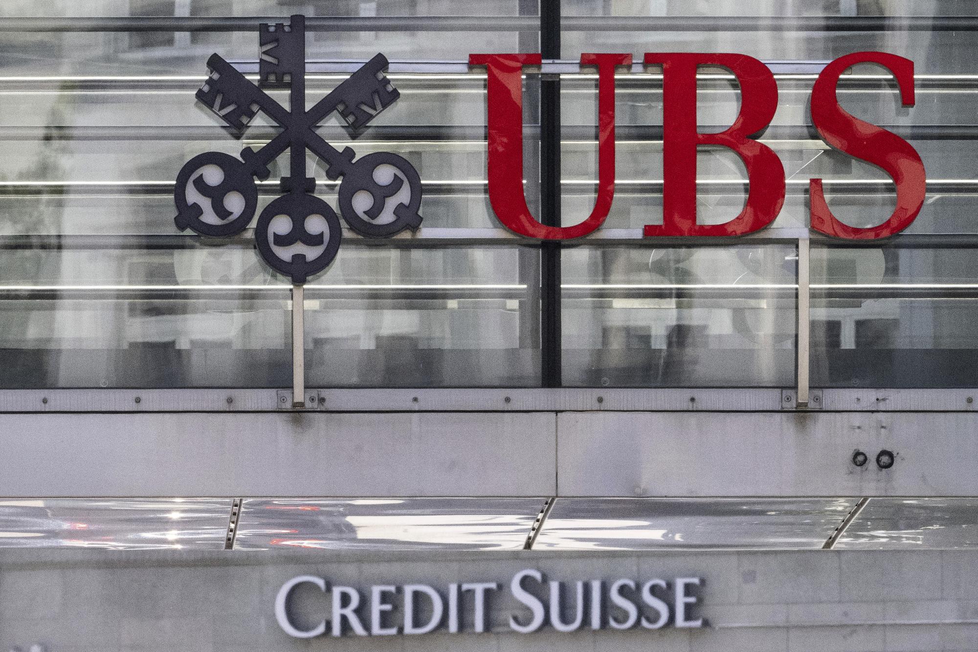 FILE - The logos of the Swiss banks Credit Suisse and UBS are pictured in Zurich, Switzerland, on June 12, 2023. Switzerland?s financial markets authority says German national Stefan Walter will be its next chief executive. The appointment comes as the rich Alpine country is looking at ways to strengthen is regulatory toolbox after last year?s blockbuster takeover of Credit Suisse by Zurich rival UBS. (Ennio Leanza/Keystone via AP, File)