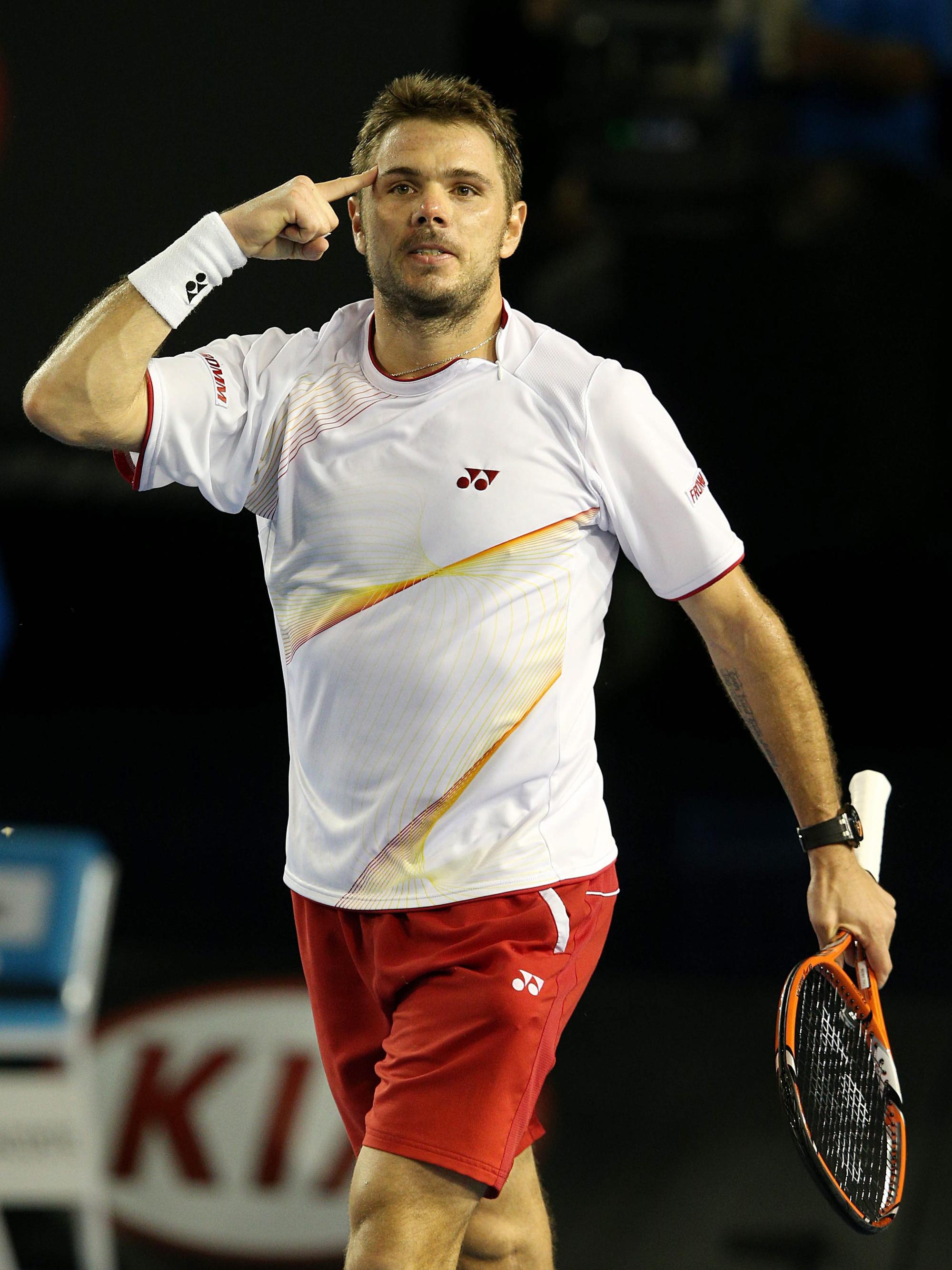 epa04038012 Stanislas Wawrinka of Switzerland celebrates after winning his match against Tomas Berdych of the Czech Republic during his match against in the semifinals of the Australian Open tennis tournament in Melbourne, Australia, 23 January 2014. EPA/MARK DADSWELL
