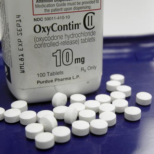 FILE - In this Feb. 19, 2013 file photo, OxyContin pills are arranged for a photo at a pharmacy in Montpelier, Vt. Companies and U.S. government entities have agreed to settlements of lawsuits over the toll of opioids totaling more than $50 billion. (AP Photo/Toby Talbot, File)