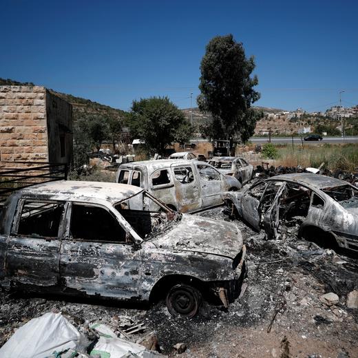 epa10703344 Burned cars in the West Bank village of Al-Lubban, next to the Israeli settlement of Eli, 21 June 2023. According to Al-Lubban village residents, Israeli settlers attacked the village and burned the petrol station and several cars, a day after a shooting attack near the Israeli settlement of Eli in which four Israelis were killed. EPA/ATEF SAFADI