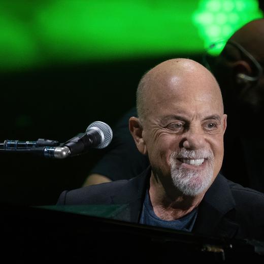(FILES) US musician Billy Joel performs during a concert at the Formula One Grand Prix at Circuit of the Americas in Austin, Texas on October 23, 2021. All eyes are on -- who else? -- Taylor Swift ahead of Sunday's Grammys, when the megastar could break the record for most Album of the Year wins at a gala where women finally are taking center stage. (Photo by SUZANNE CORDEIRO / AFP)
