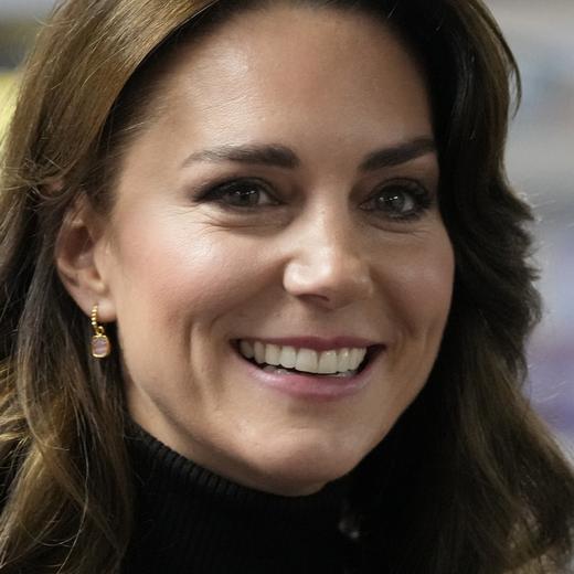 FILE - Kate, Princess of Wales smiles as she speaks to a woman during her visit to Sebby's Corner in north London on Nov. 24, 2023. Charles' illness comes at a awkward time, as his daughter in law, the Princess of Wales, has also had her own health issues, having recently been hospitalized for two weeks following abdominal surgery following at the private London clinic. The former Kate Middleton won't be returning to public duties until after Easter and that will prompt other members of the royal family to pick up the slack. (AP Photo/Frank Augstein, Pool)