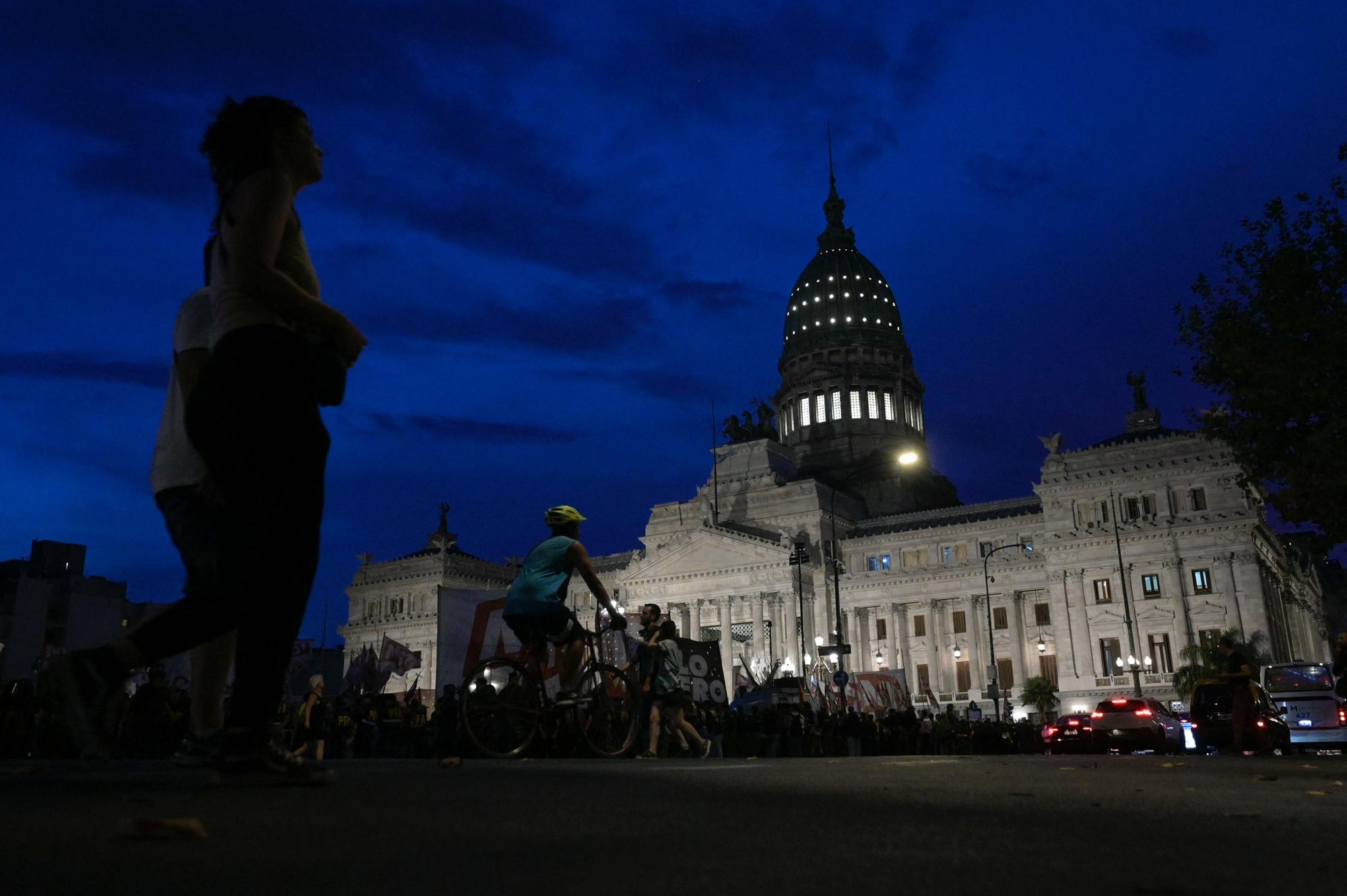 View of the Congress after Argentine lawmakers suspended the debate on President Javier Milei's controversial ultra-liberal bill of economic reforms in Buenos Aires on February 6, 2024. The Chamber of Deputies of Argentina approved on Tuesday "delegated powers" for President Javier Milei and the declaration of economic and security emergency in the country, as part of a package of far-right reforms that the Senate must discuss. On the other hand, the opposition rejected a broad reform of the State that would have allowed Milei to intervene, reorganize, dissolve or totally or partially suppress public organizations in sensitive areas such as science and research. (Photo by Juan Mabromata / AFP)