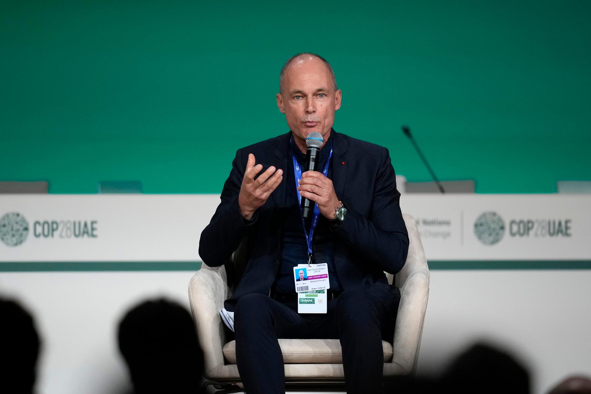 Bertrand Piccard speaks during an event at the COP28 U.N. Climate Summit, Monday, Dec. 11, 2023, in Dubai, United Arab Emirates. (AP Photo/Rafiq Maqbool)