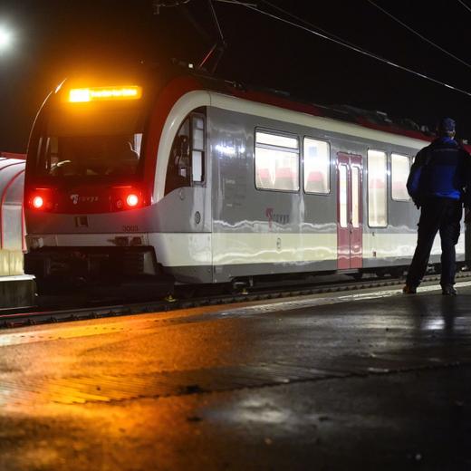 epa11138200 Two Vaud cantonal police officers look at the Travys train where a hostage-taking incident took place at Essert-sous-Champvent station, in Essert-sous Champvent, Switzerland, 08 February, 2024. The incident took place on a regional train between Yverdon and Sainte-Croix at around 6:30pm. All hostages were freed and are safe. EPA/LAURENT GILLIERON