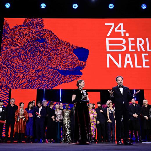 Berlinale Executive Director Mariette Rissenbeek and Berlinale Artistic Director Carlo Chatrian speak on stage in front of all the laureates during the awards ceremony of the 74th Berlinale International Film Festival, on February 24, 2024 in Berlin. (Photo by JOHN MACDOUGALL / AFP)