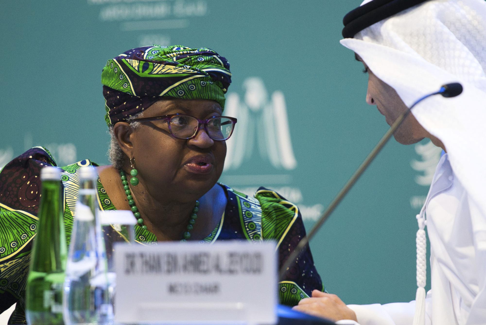 World Trade Organization Director-General Ngozi Okonjo-Iweala talks to Emirati Minister of State for Foreign Trade Thani bin Ahmed al-Zeyoudi on stage at a WTO summit in Abu Dhabi, United Arab Emirates, Monday, Feb. 26, 2024. The World Trade Organization opened its biennial meeting Monday in the United Arab Emirates as the bloc faces pressure from the United States and other nations ahead of a year of consequential elections around the globe. (AP Photo/Jon Gambrell)  Ngozi Okonjo-Iweala