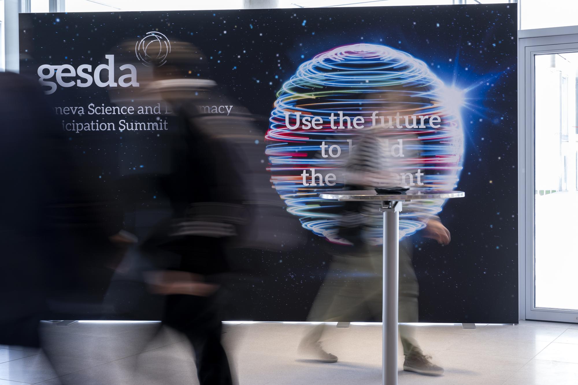 People are arriving for the start, during the opening of the 3rd Geneva Science and Diplomacy Anticipation Summit 2023 (GESDA) at the CERN's Science Gateway in Geneva, Switzerland, Wednesday, October 11, 2023. The 3rd Geneva Science and Diplomacy Anticipation Summit 2023 will be held at the CERN's Science Gateway, from 11 to 13 October. (KEYSTONE/Martial Trezzini)