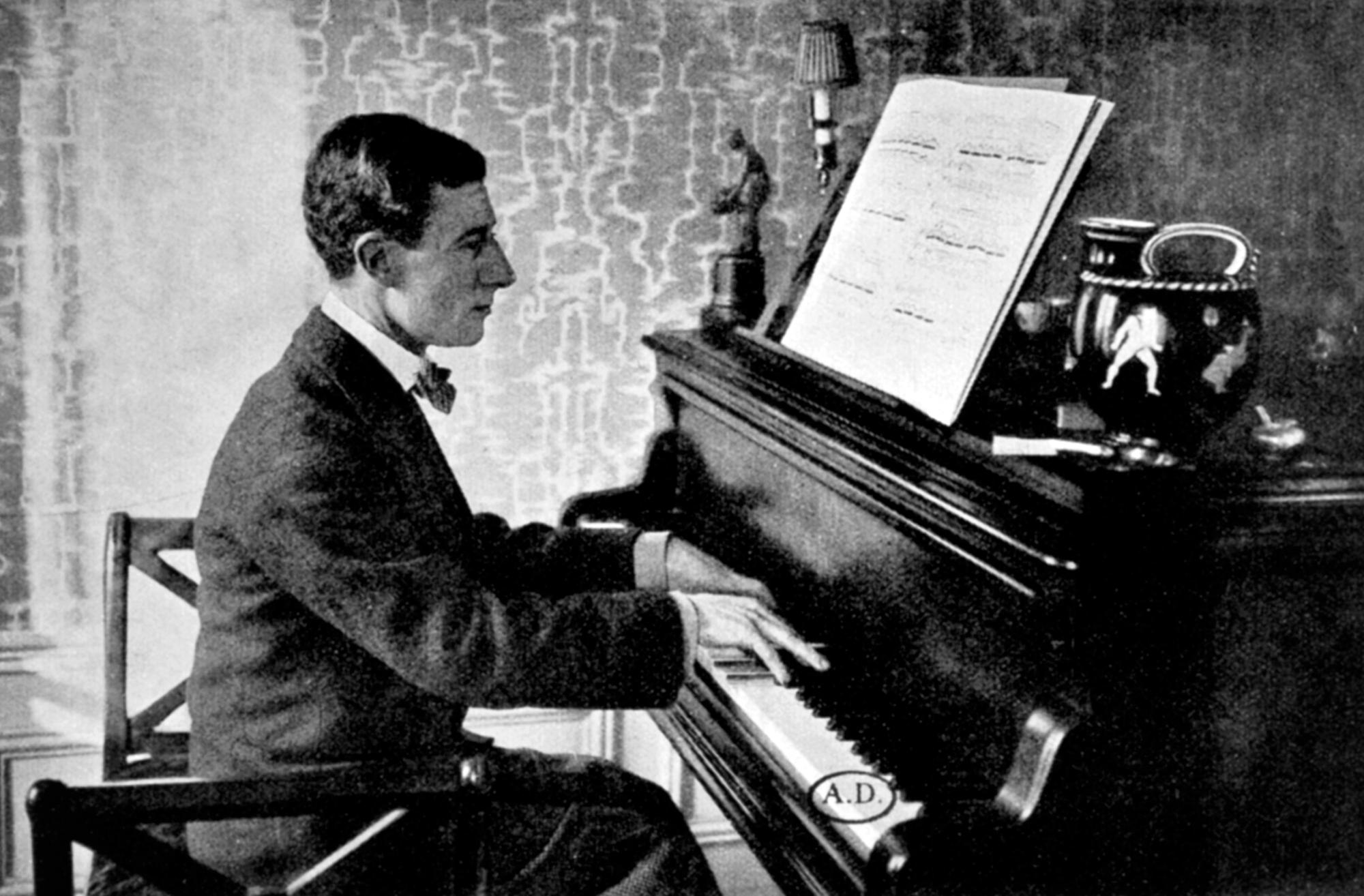 FRANCE - JANUARY 15: Joseph-Maurice Ravel (Ciboure, 1875-Paris, 1937), French composer and pianist at the piano in his apartment on Carnot Avenue in Paris, March 1934. Paris, Bibliothèque Des Arts Decoratifs (Library) (Photo by DeAgostini/Getty Images)