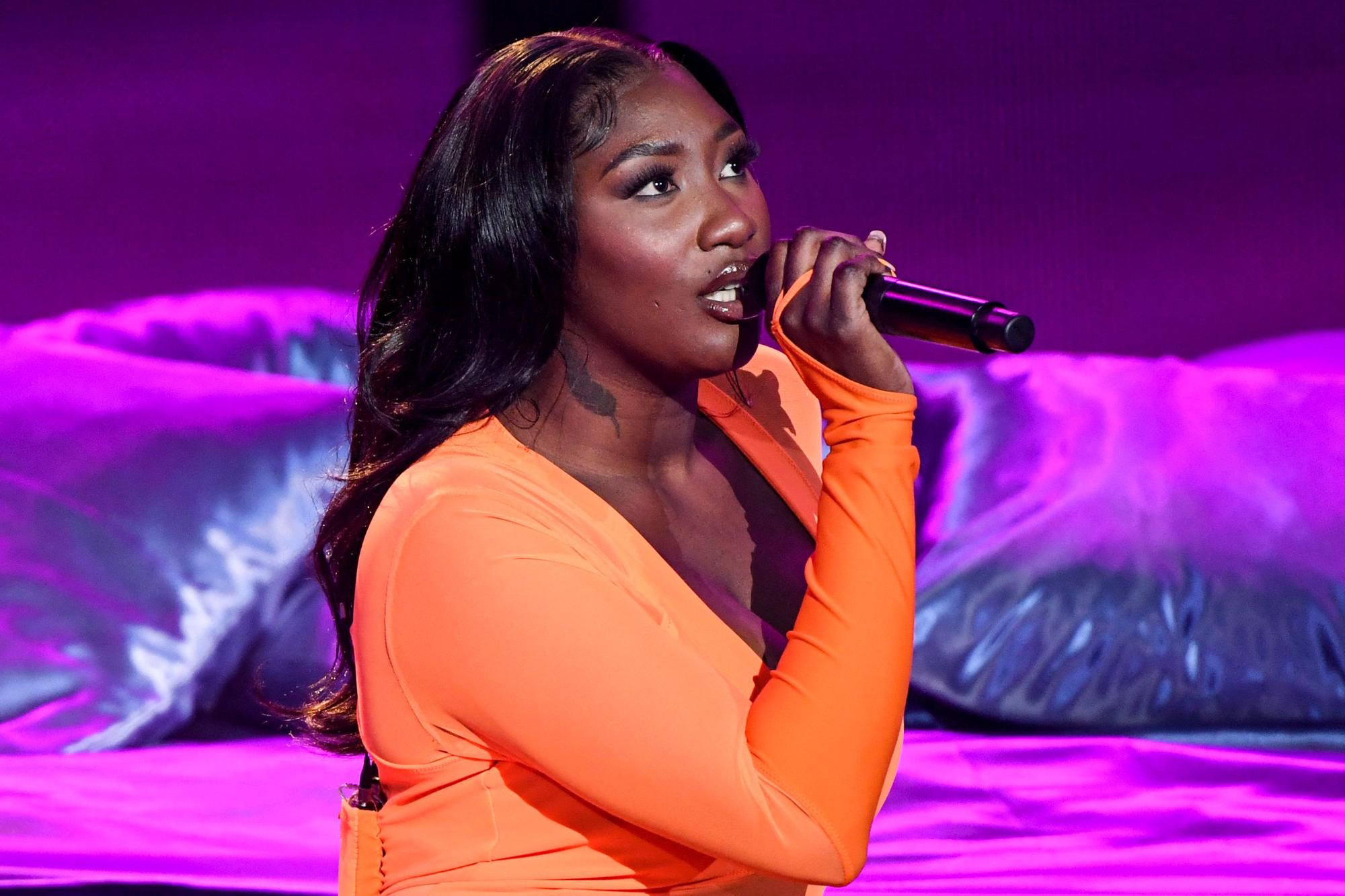(FILES) French singer Aya Coco Danioko aka Aya Nakamura performs on stage during the 36th Victoires de la Musique, the annual French music awards ceremony, at the Seine Musicale concert hall in Boulogne-Billancourt, on the outskirts of Paris, on February 12, 2021. A rumour that France's biggest music star Aya Nakamura might sing an Edith Piaf song during the Paris Olympics opening ceremony drew an angry reaction from far-right groups. Local media reported that the French-Malian singer discussed the possibility of performing a song by 20th century icon Piaf when she met President Emmanuel Macron last month, though neither party has confirmed the rumour. (Photo by Bertrand GUAY / AFP)