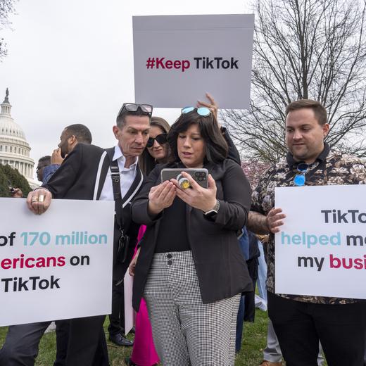 Devotees of TikTok monitor voting at the Capitol in Washington, as the House passed a bill that would lead to a nationwide ban of the popular video app if its China-based owner doesn't sell, Wednesday, March 13, 2024. Lawmakers contend the app's owner, ByteDance, is beholden to the Chinese government, which could demand access to the data of TikTok's consumers in the U.S. (AP Photo/J. Scott Applewhite)