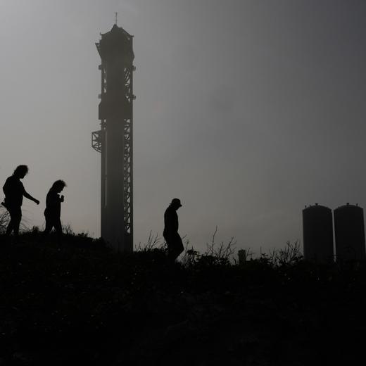 A haze moves across the area as visitors watch SpaceX's mega rocket Starship being prepared for it's third test flight from Starbase in Boca Chica, Texas, Wednesday, March 13, 2024. (AP Photo/Eric Gay)